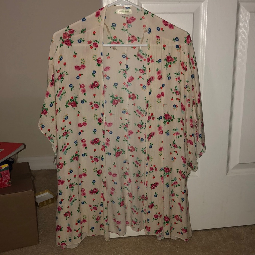 White cardigan with pink flowers